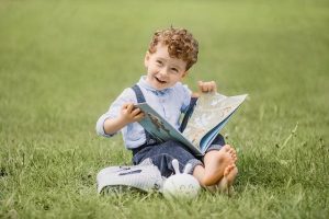 image for child reading happily
